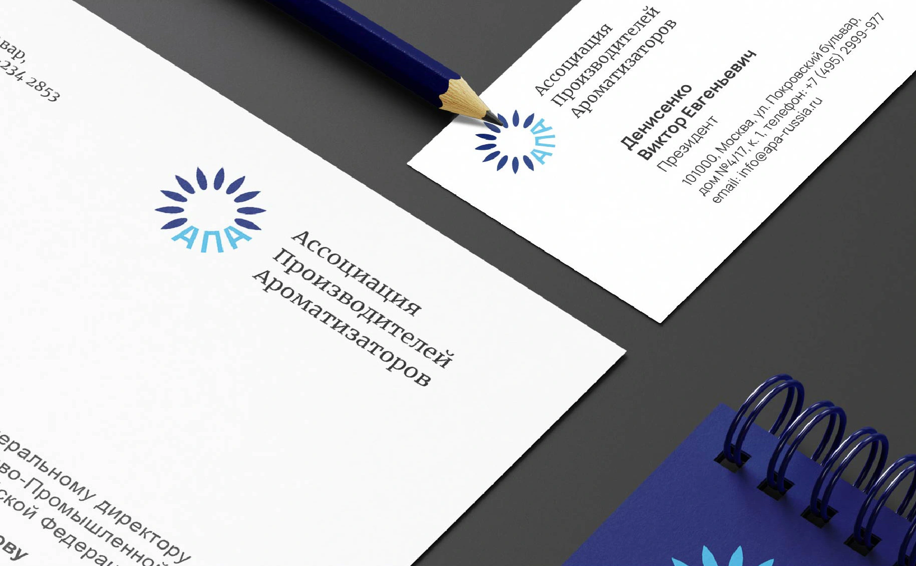 Close-up of the APA sunflower identity on original business cards
